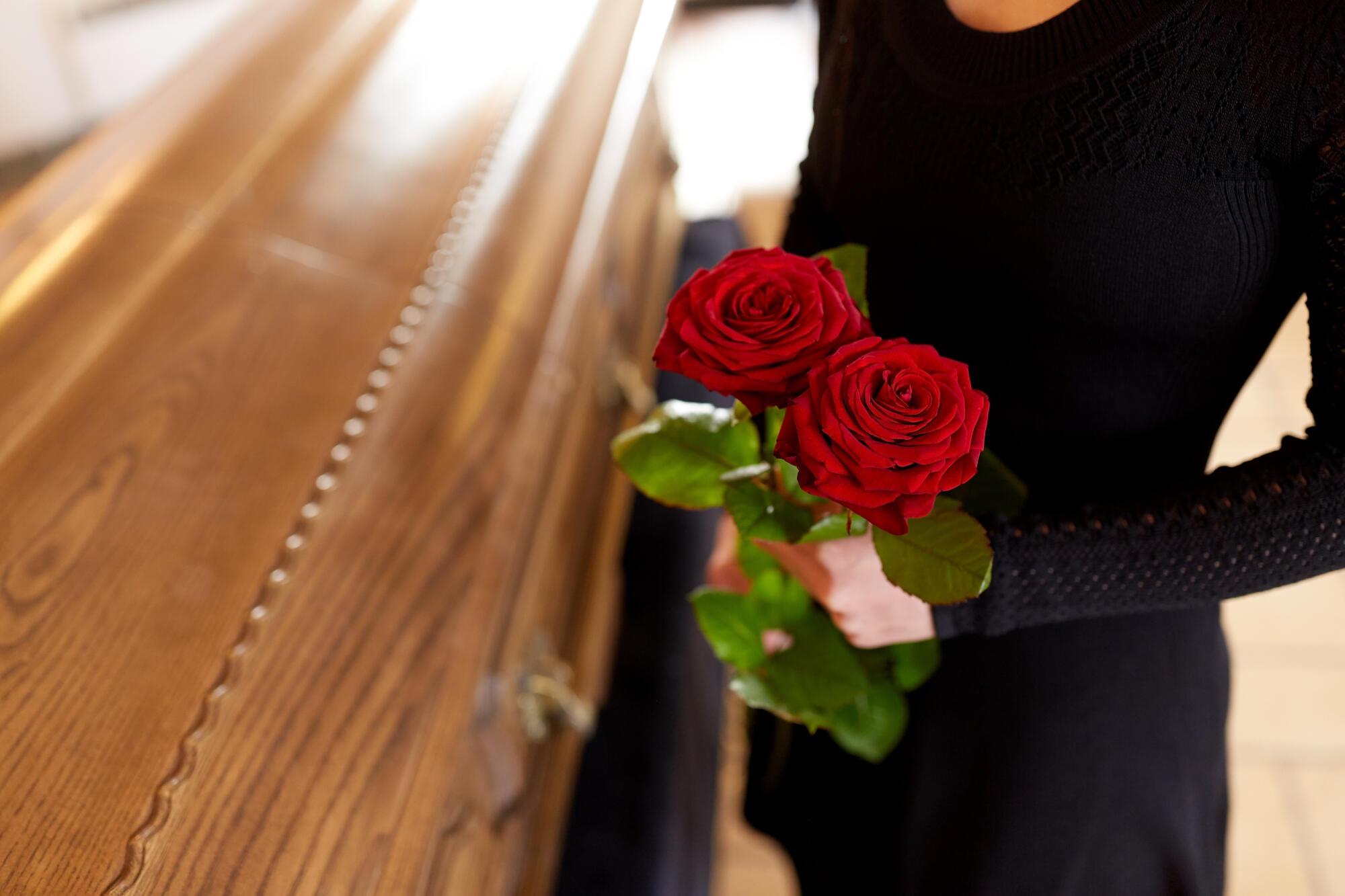 People,And,Mourning,Concept,-,Woman,With,Red,Roses,And