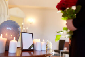 Urn and candles at a memorial gathering